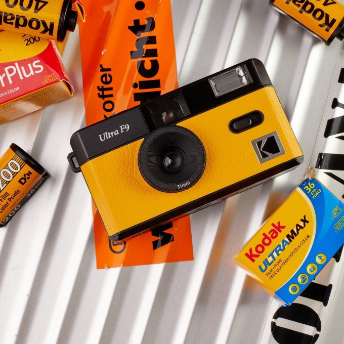 KODAK Film Camera ULTRA F9 Yellow on camera case among film packages